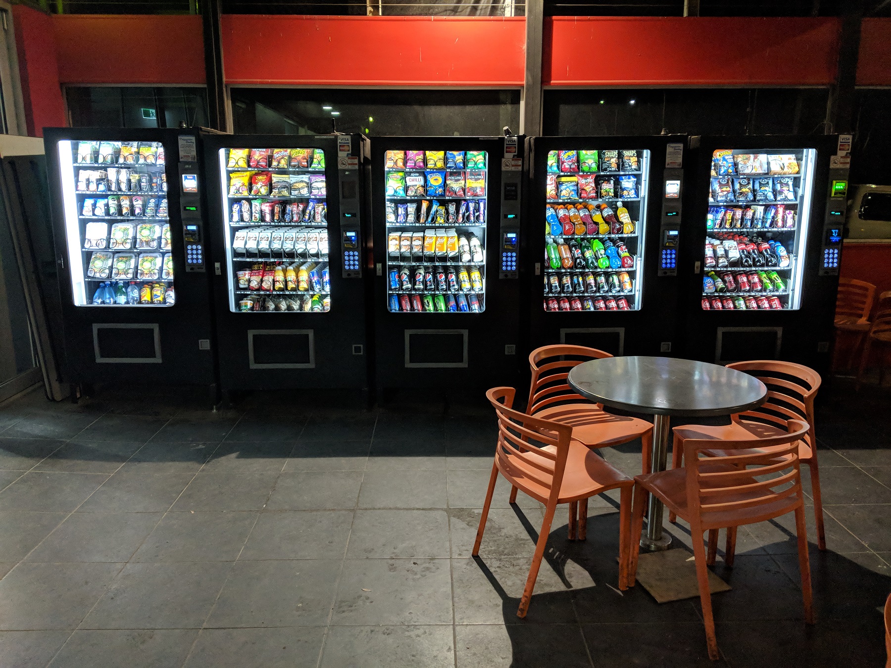 Row of fully-stocked vending machines